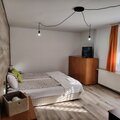 Monthly Apartment Rentals: Studio with sofa and balcony 